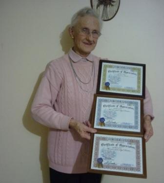 Marion Hume presenting her Certificates of Appreciation